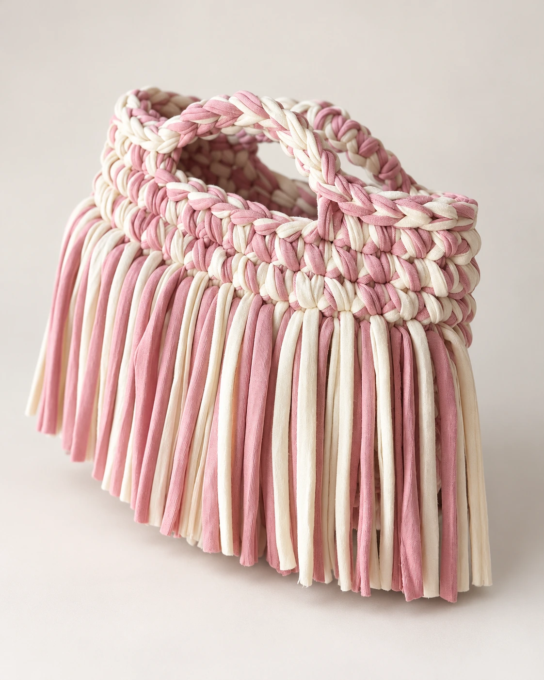 Borsa rosa antico e panna con frange